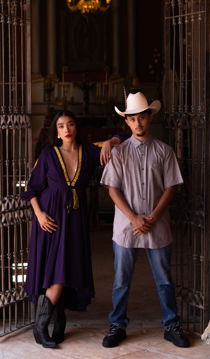The Art of Drawing Readers In: Your attractive post title goes here A couple in traditional clothing poses in an elegant, historical interior.